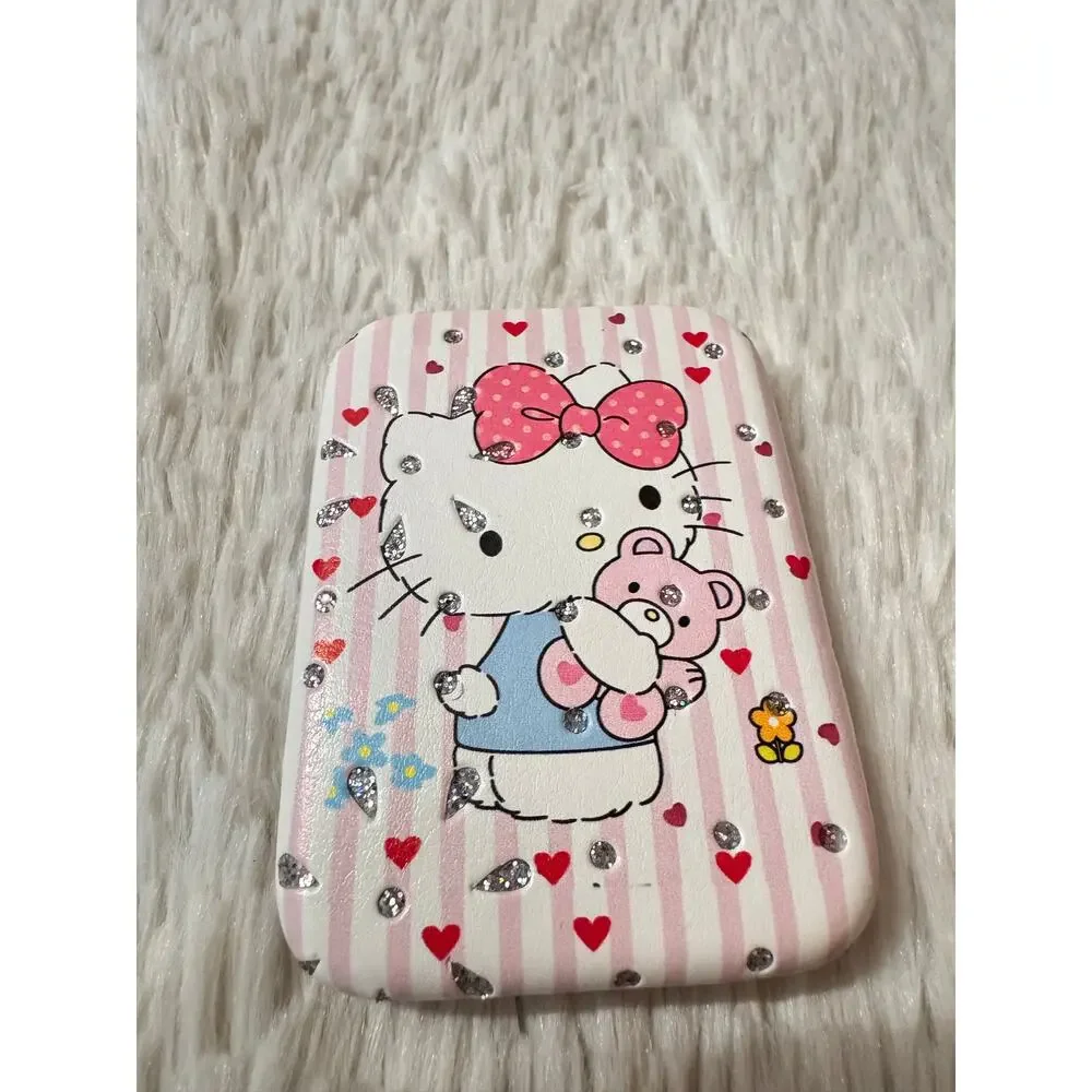 Hello Kitty pink & white striped compact mirror holding a teddy bear sparkly